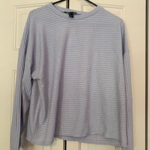 Blue long sleeve sweater. Never worn.